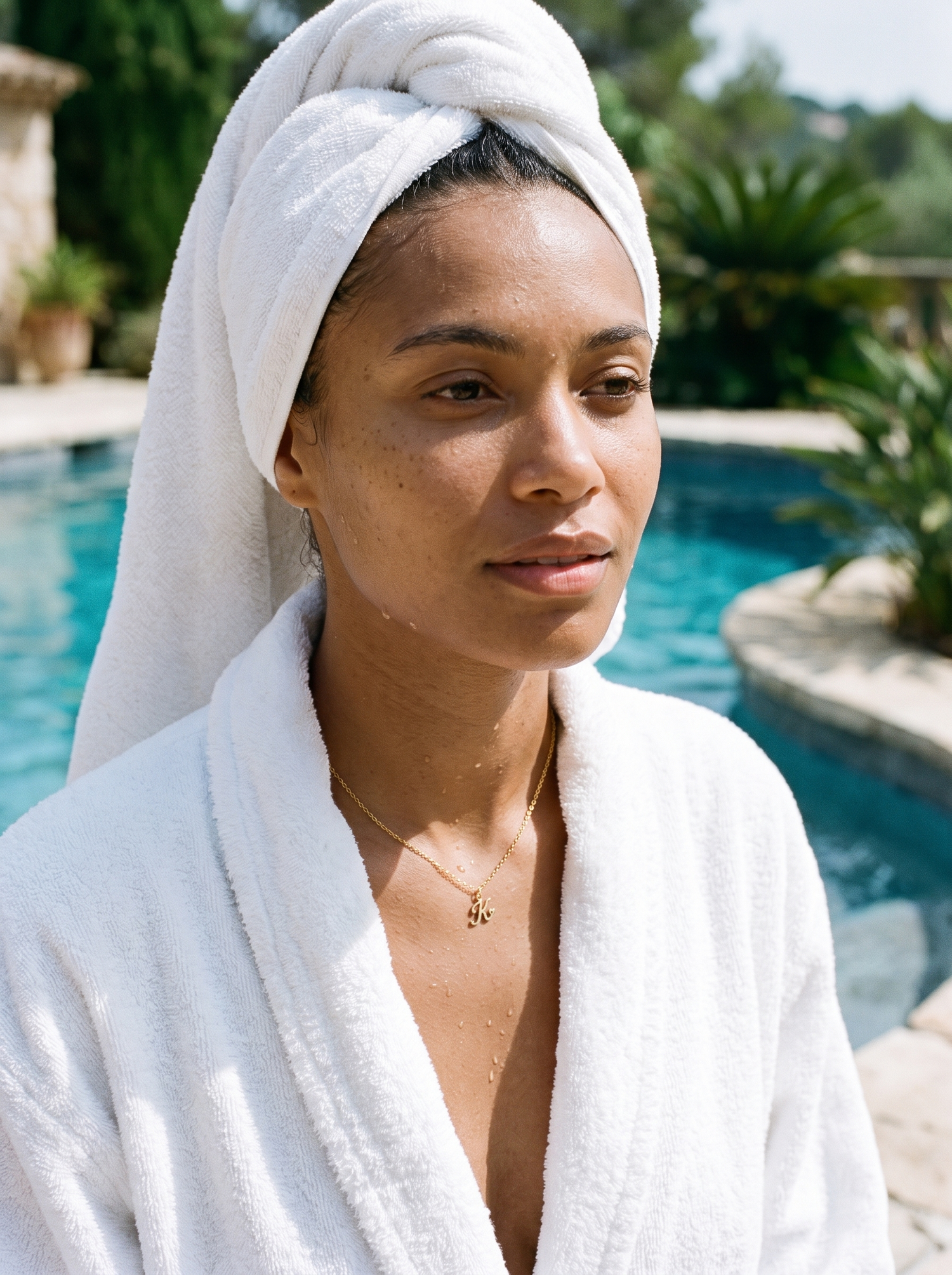 Aurelle heart initial necklace worn poolside