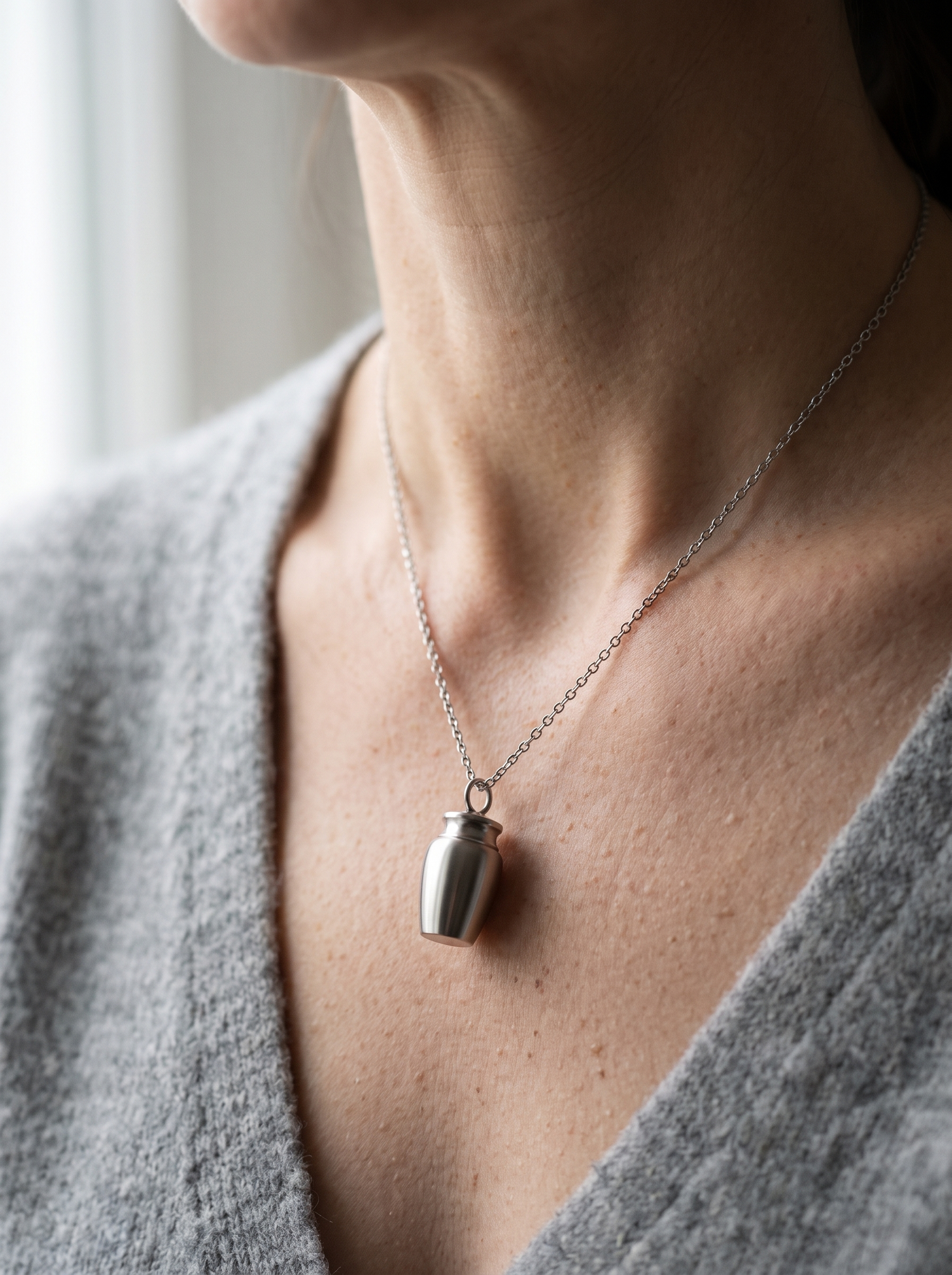 Aurelle memorial urn pendant worn quietly