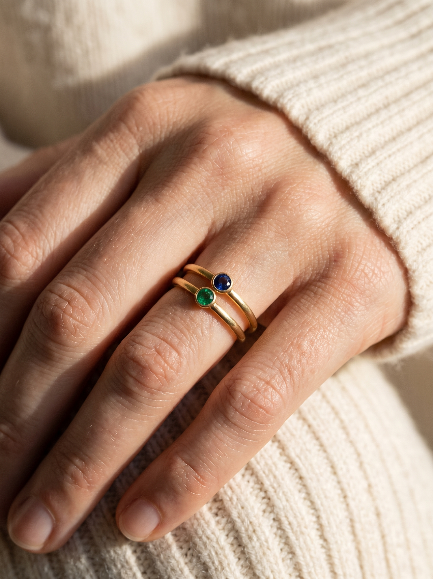 Aurelle birthstone rings stacked together