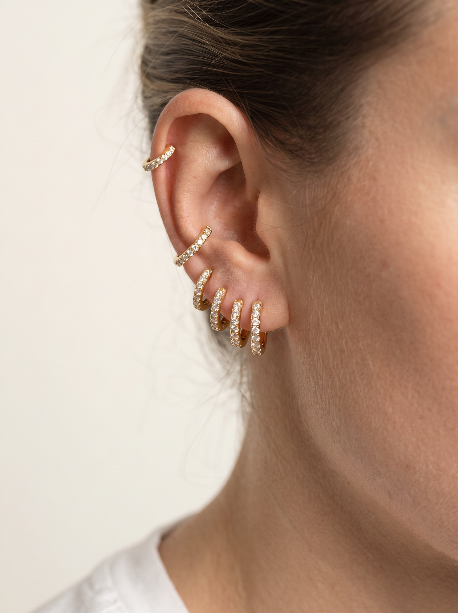 Aurelle huggie hoops stacked up the ear