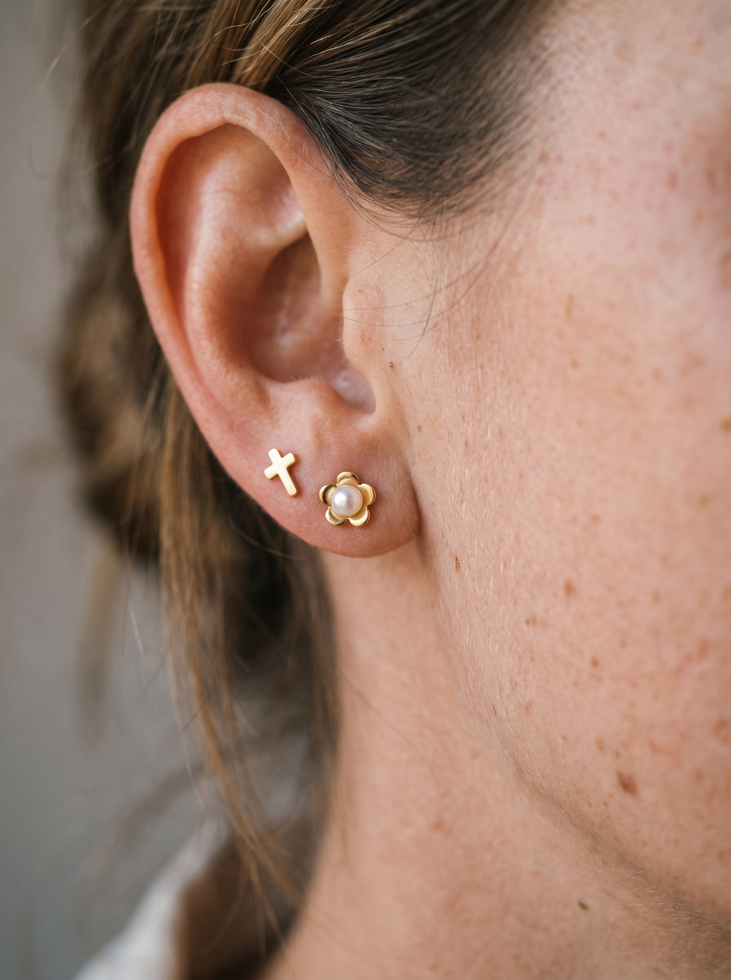 Aurelle flower and cross pearl studs close detail
