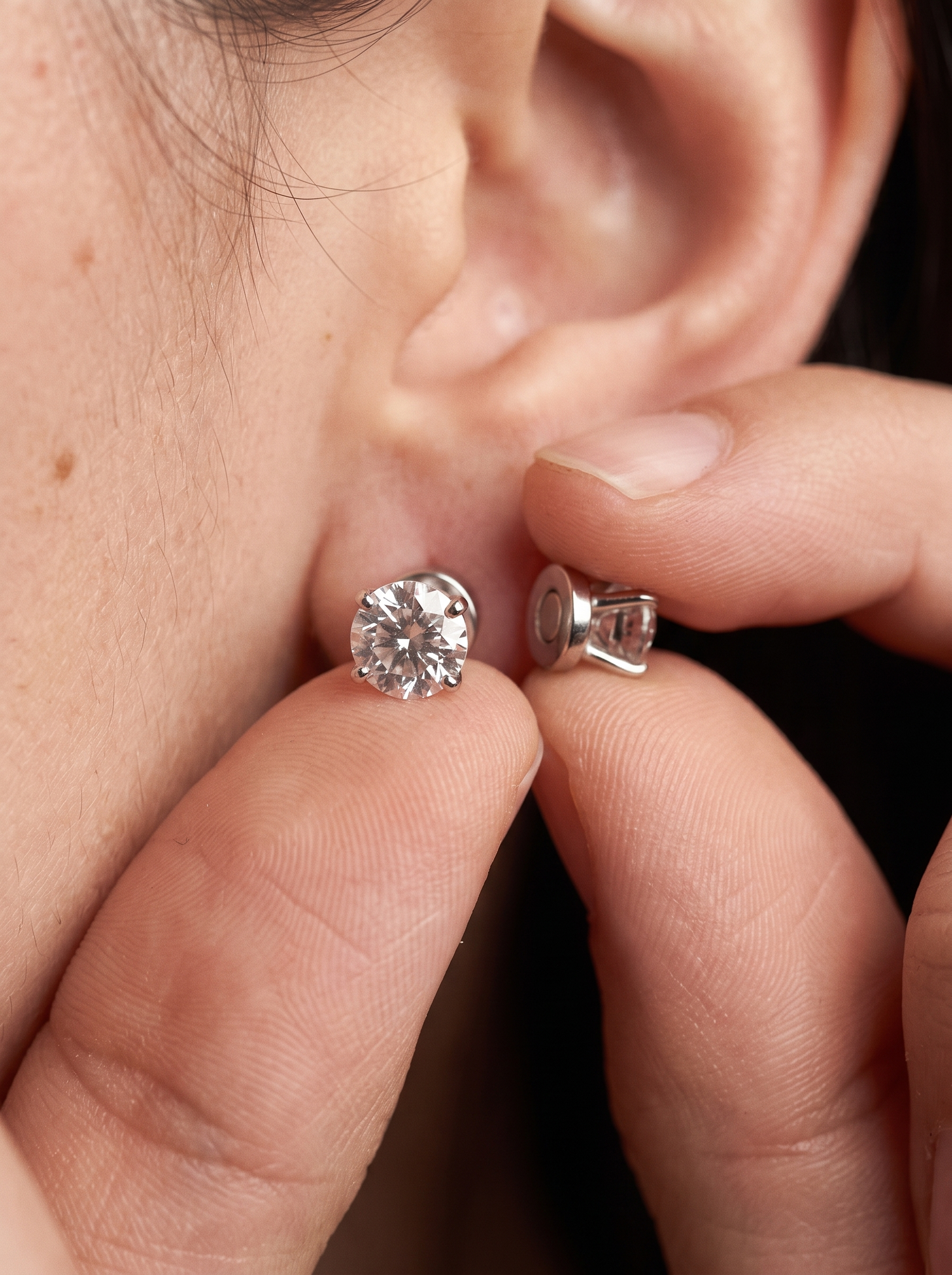 Aurelle magnetic stud being fitted