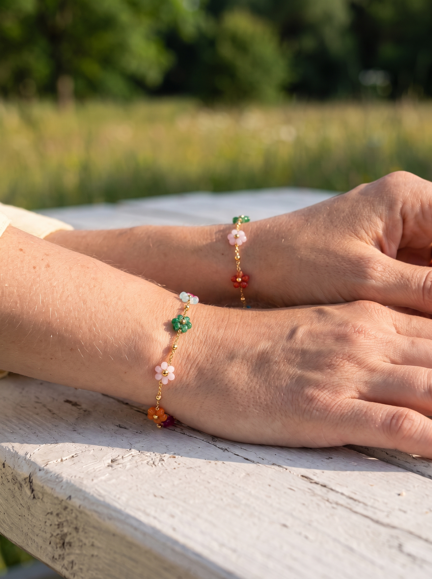 Aurelle enamel flower bracelets worn by friends